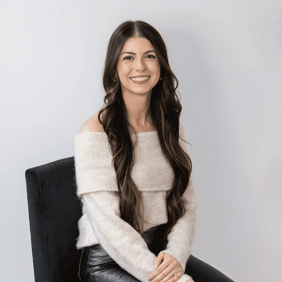Portrait of Allie Harris, a professional stylist at Revive Hair Salon & Day Spa, showcasing their expertise and style.