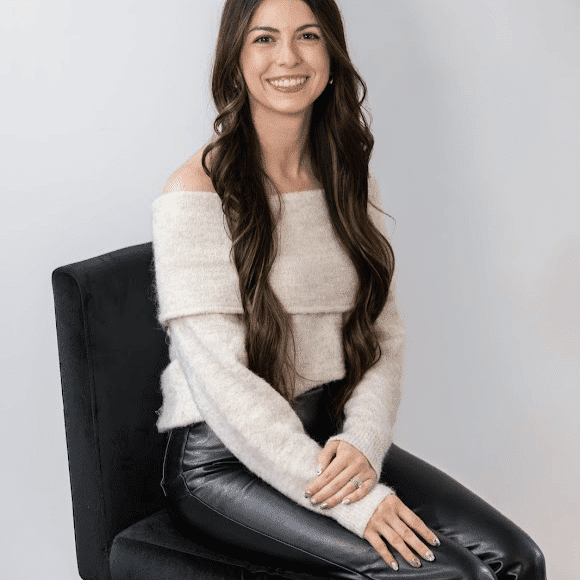 Portrait of Allie Harris, a professional stylist at Revive Hair Salon & Day Spa, showcasing their expertise and style.