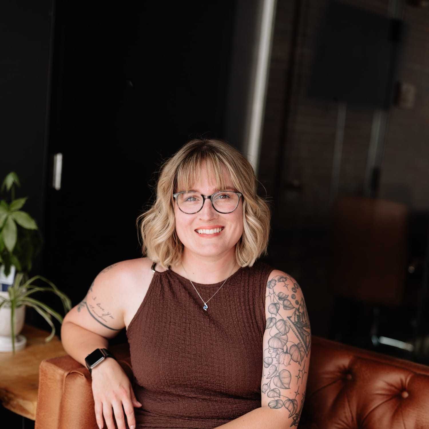 Portrait of Maddy Timmerman, a professional stylist at Revive Hair Salon & Day Spa, showcasing their expertise and style.