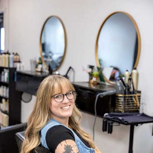 Portrait of Maddy Timmerman, a professional stylist at Revive Hair Salon & Day Spa, showcasing their expertise and style.