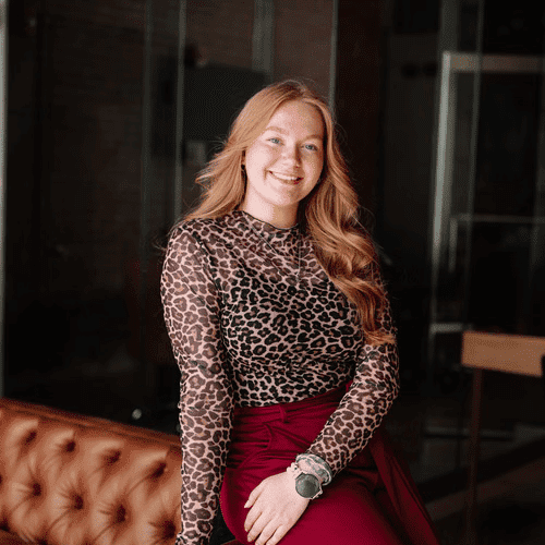 Portrait of Emma Wertz, a professional stylist at Revive Hair Salon & Day Spa, showcasing their expertise and style.