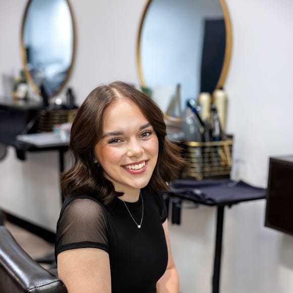 Portrait of Sara Lynch, a professional stylist at Revive Hair Salon & Day Spa, showcasing their expertise and style.