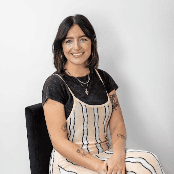 Portrait of Nicolette Oakley, a professional stylist at Revive Hair Salon & Day Spa, showcasing their expertise and style.