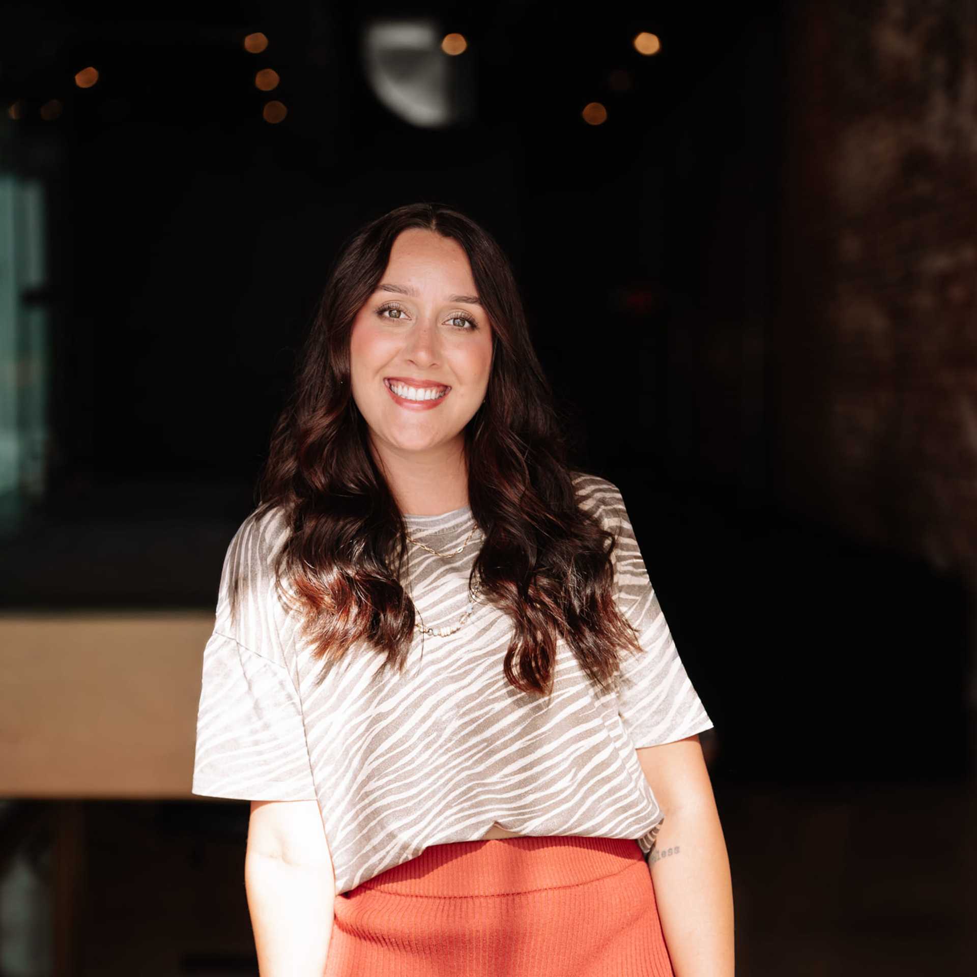 Portrait of Emma Farison, a professional stylist at Revive Hair Salon & Day Spa, showcasing their expertise and style.