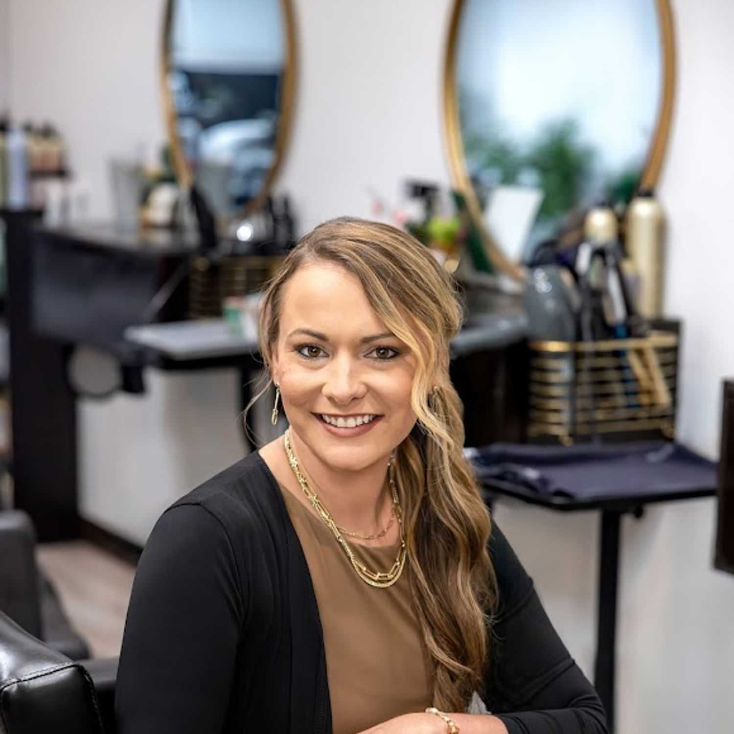 Portrait of Ashley Boehler, a professional stylist at Revive Hair Salon & Day Spa, showcasing their expertise and style.