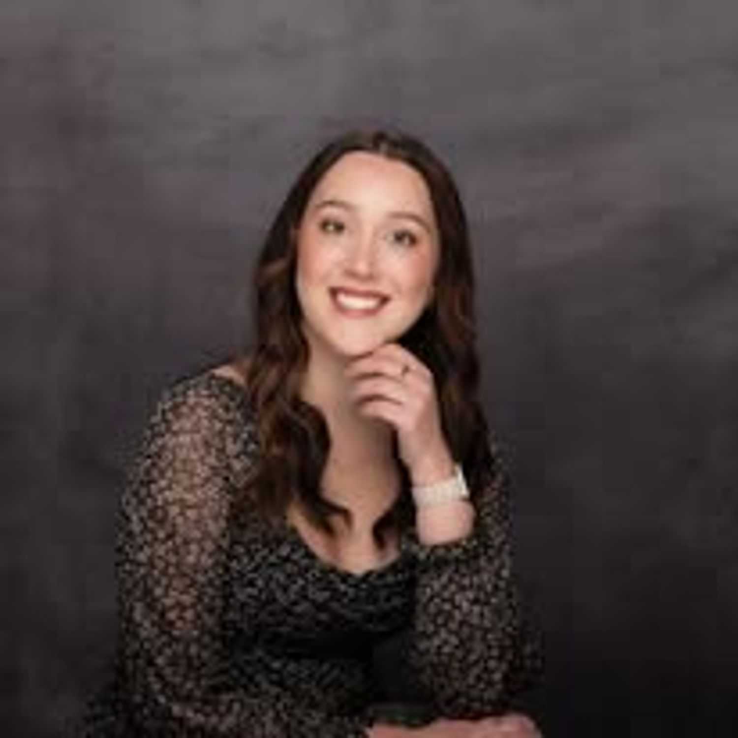 Portrait of Emma Farison, a professional stylist at Revive Hair Salon & Day Spa, showcasing their expertise and style.