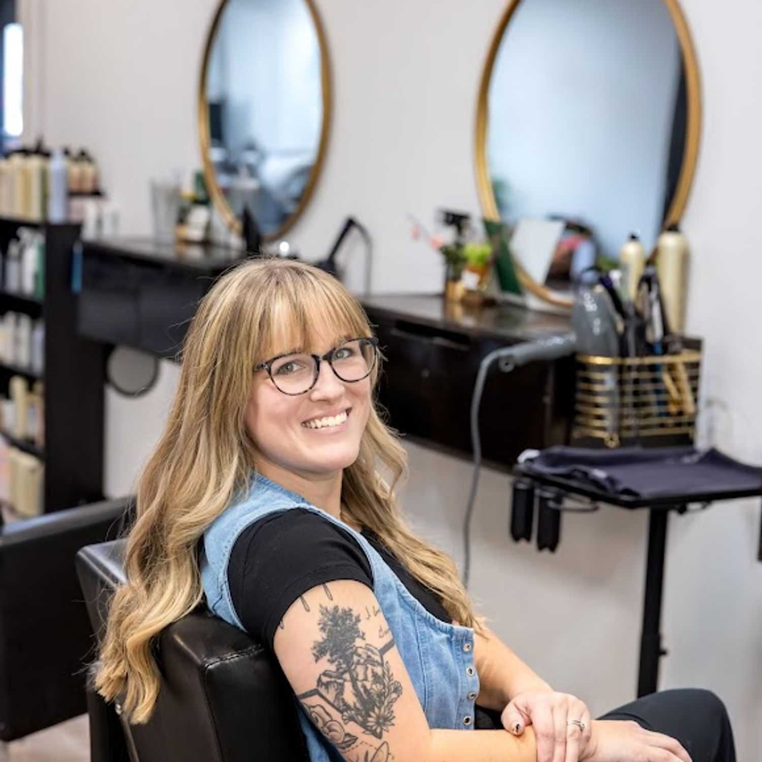 Portrait of Maddy Timmerman, a professional stylist at Revive Hair Salon & Day Spa, showcasing their expertise and style.