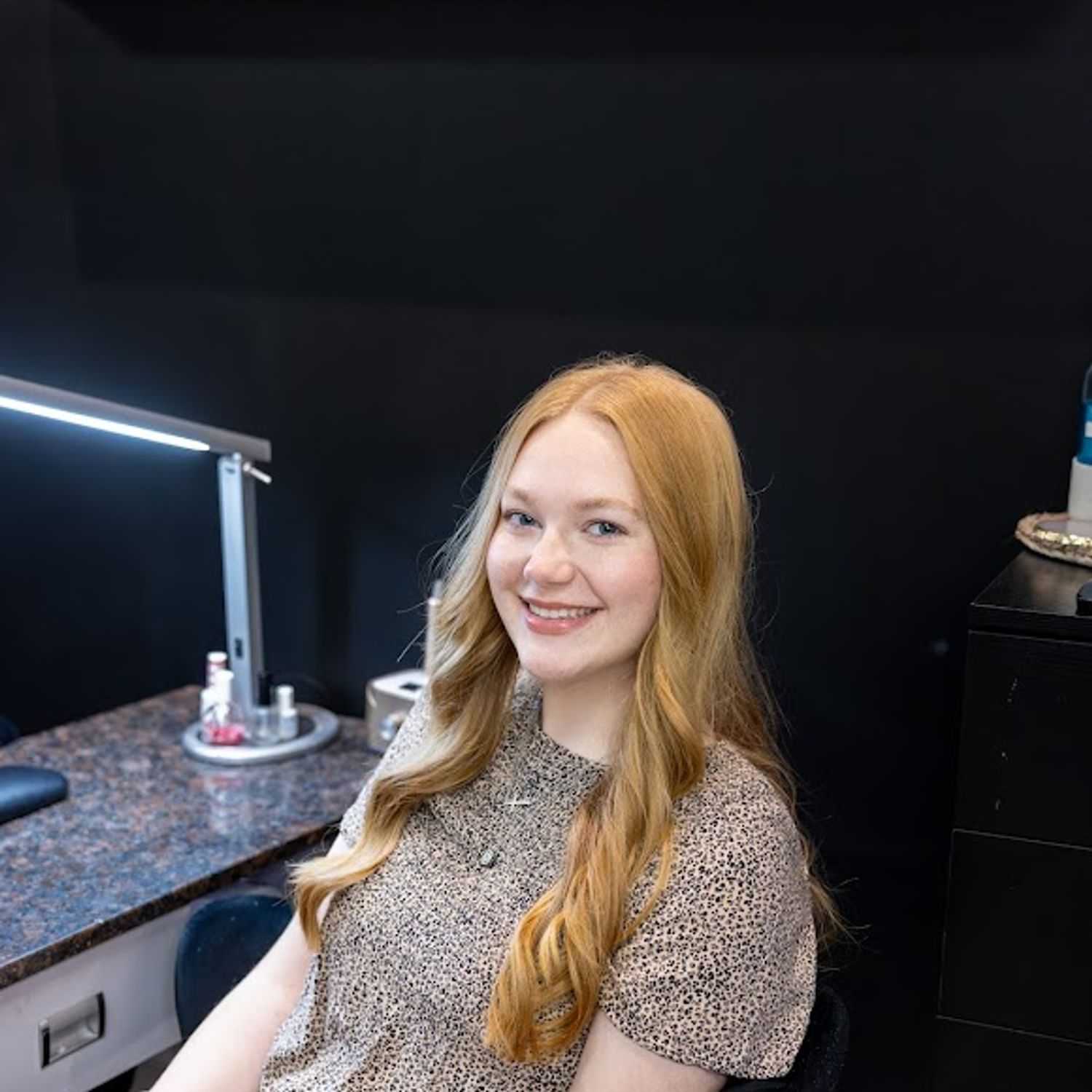 Portrait of Emma Wertz, a professional stylist at Revive Hair Salon & Day Spa, showcasing their expertise and style.