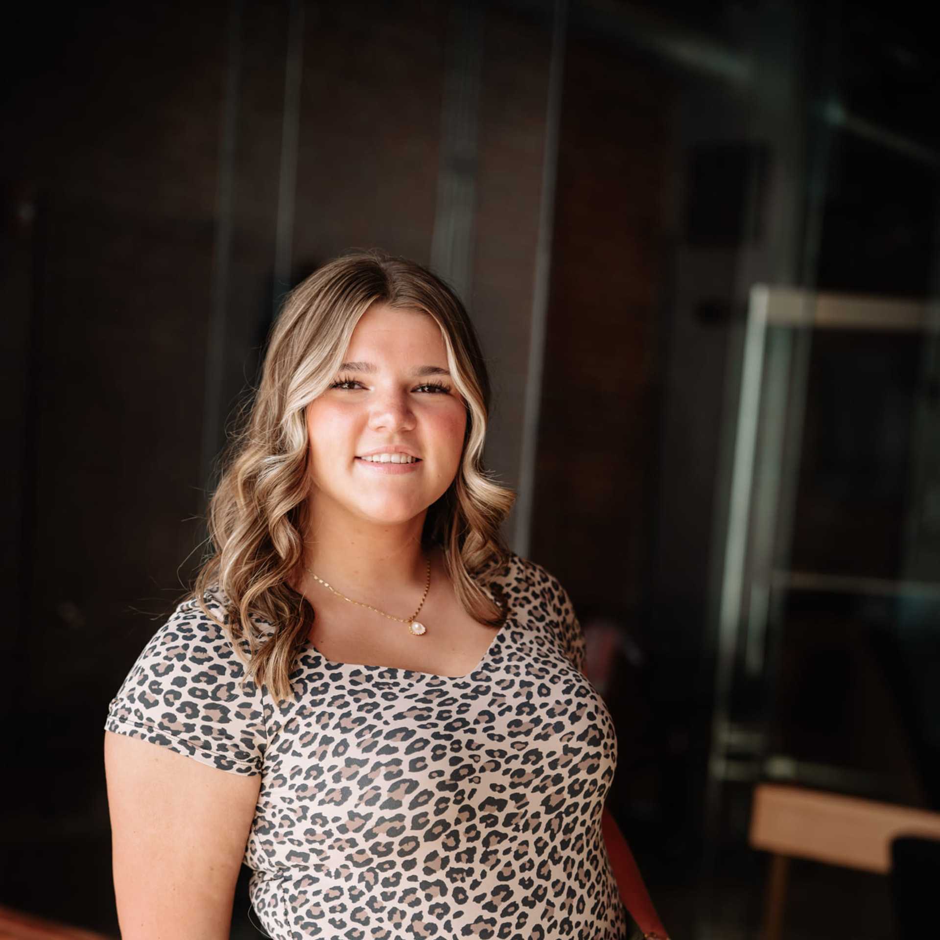 Portrait of Addisyn Bacon, a professional stylist at Revive Hair Salon & Day Spa, showcasing their expertise and style.
