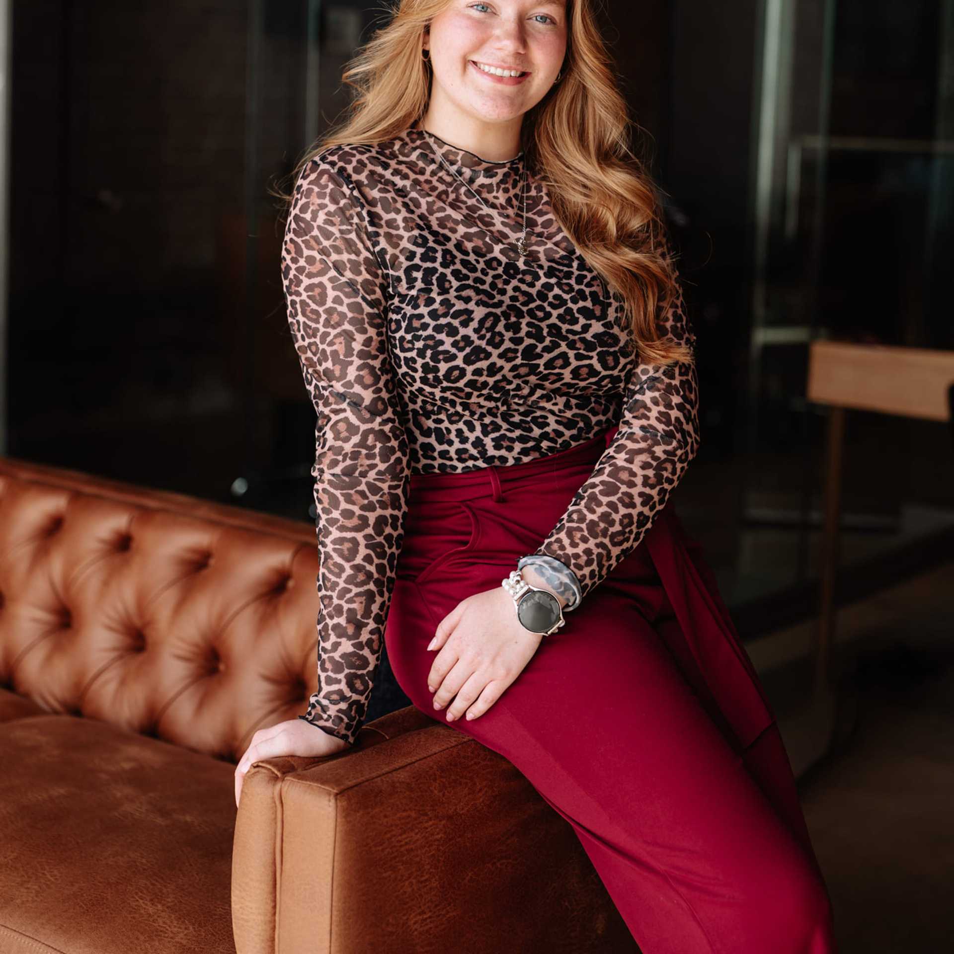 Portrait of Emma Wertz, a professional stylist at Revive Hair Salon & Day Spa, showcasing their expertise and style.