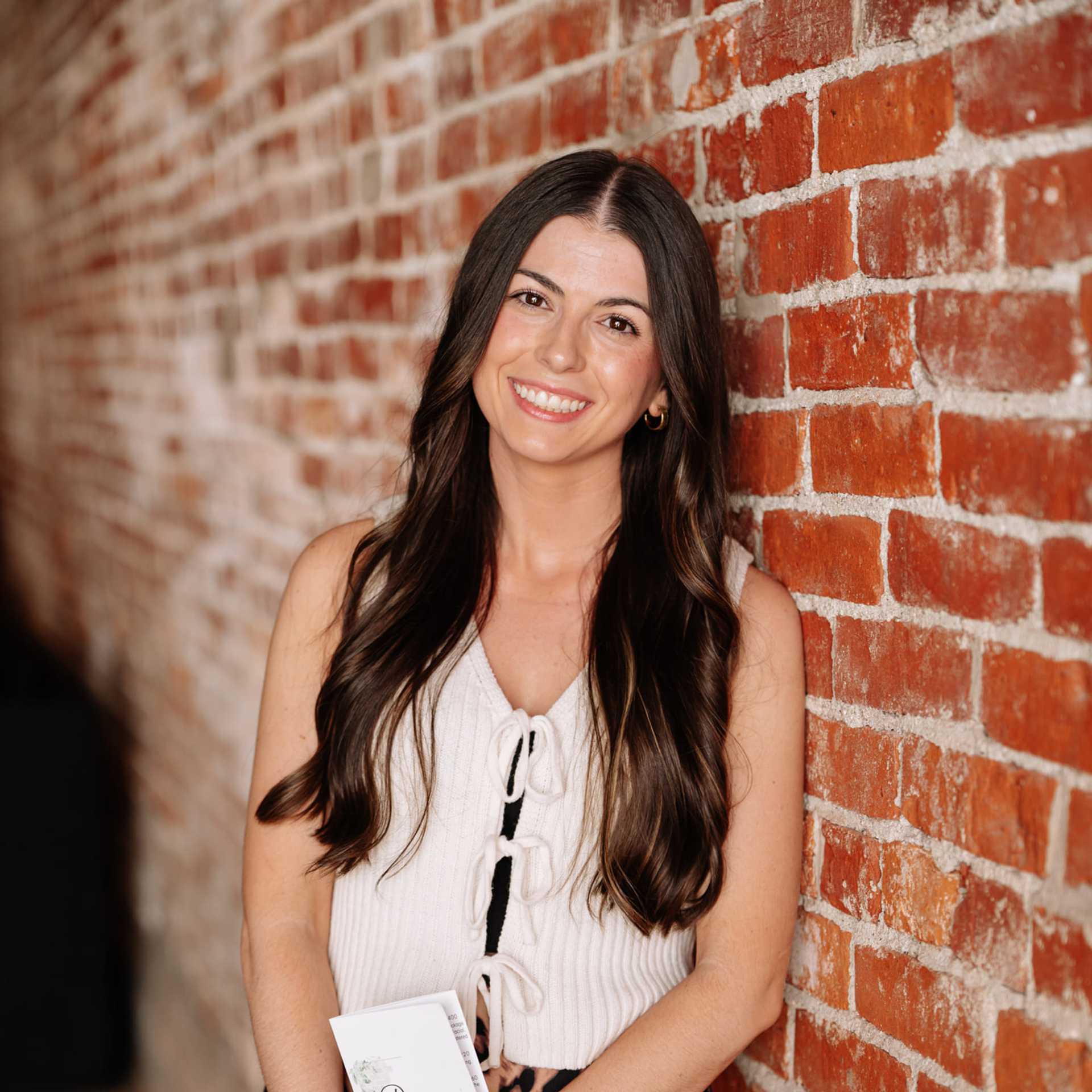 Portrait of Allie Harris, a professional stylist at Revive Hair Salon & Day Spa, showcasing their expertise and style.