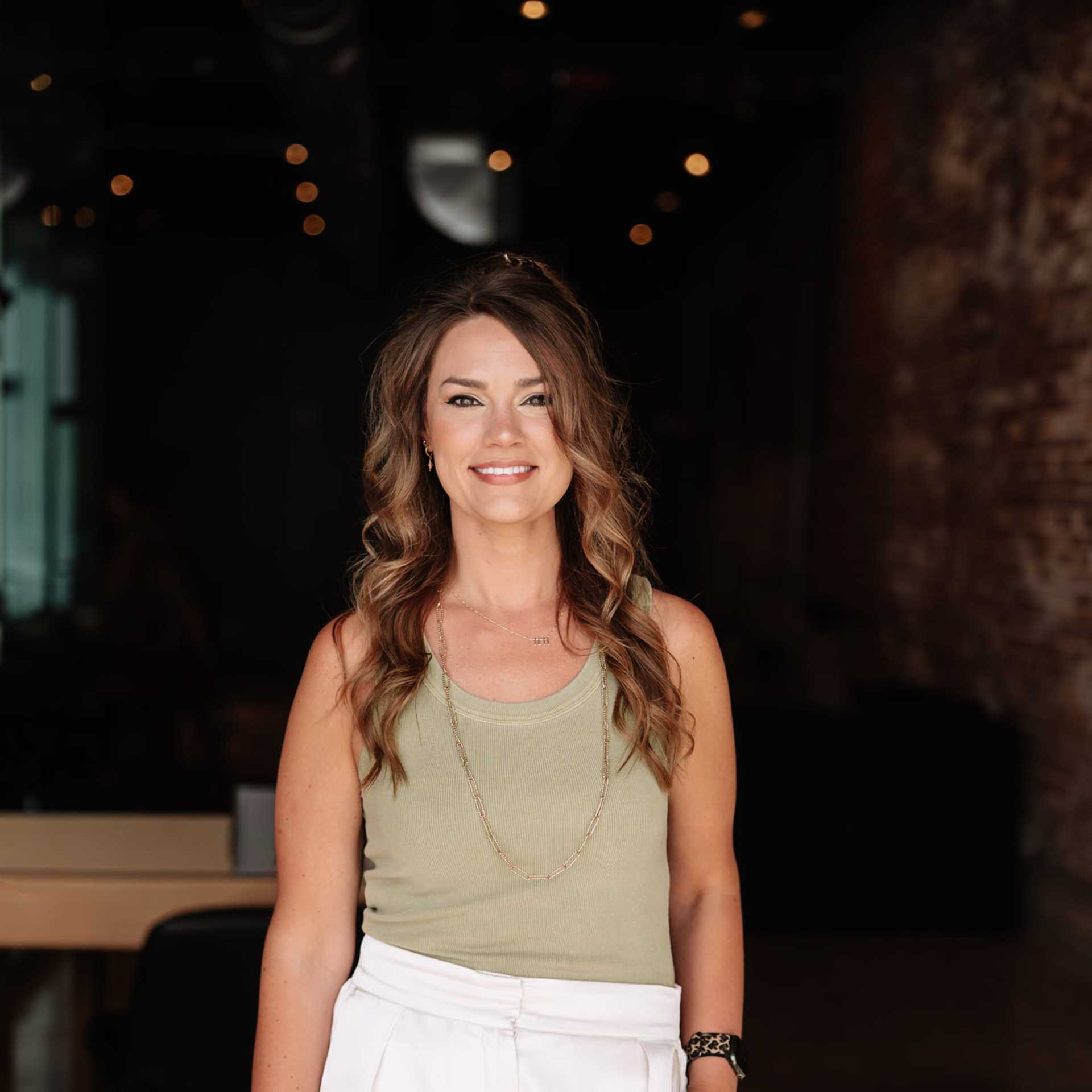 Portrait of Weslie Cheney, a professional stylist at Revive Hair Salon & Day Spa, showcasing their expertise and style.