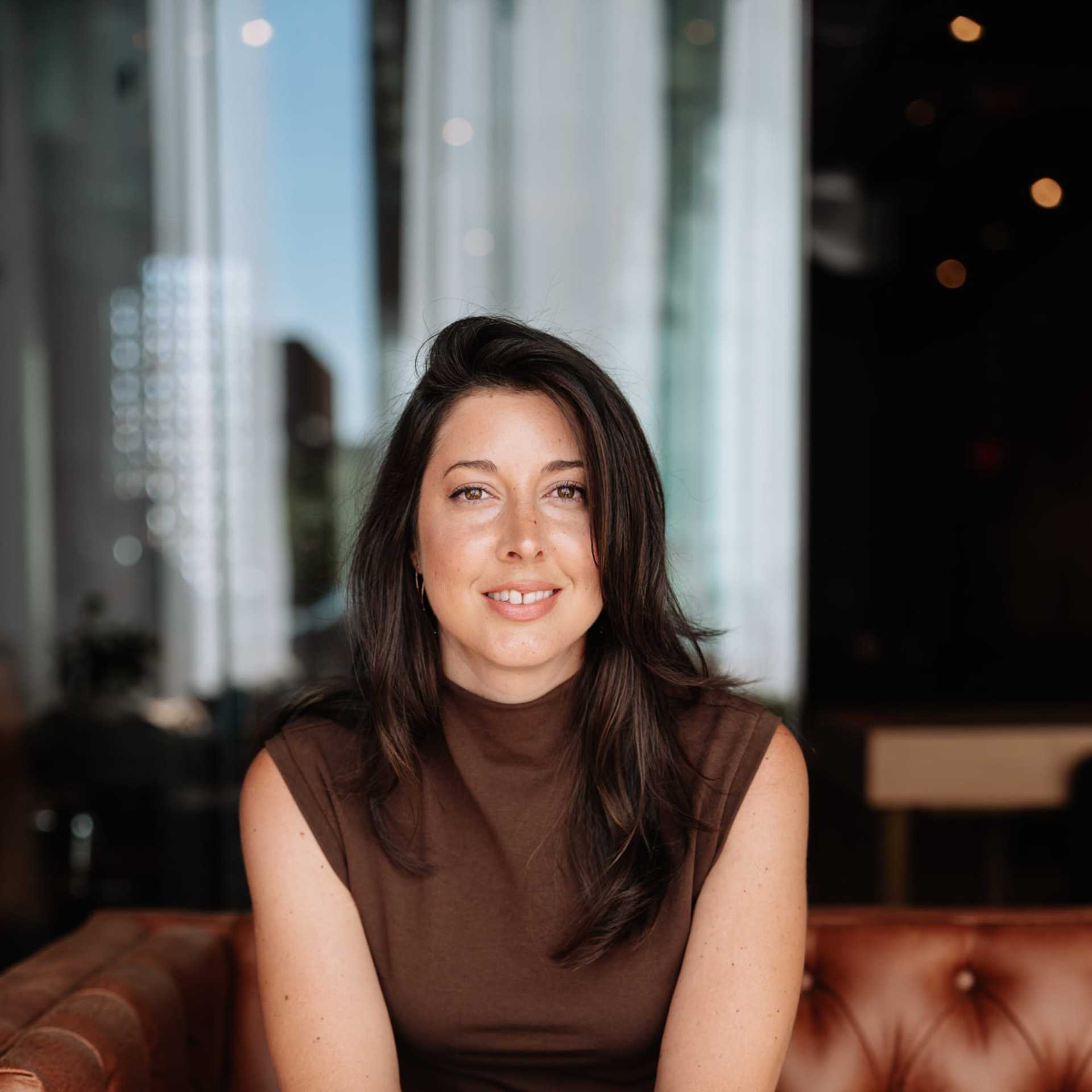 Portrait of Emily Adkins, a professional stylist at Revive Hair Salon & Day Spa, showcasing their expertise and style.