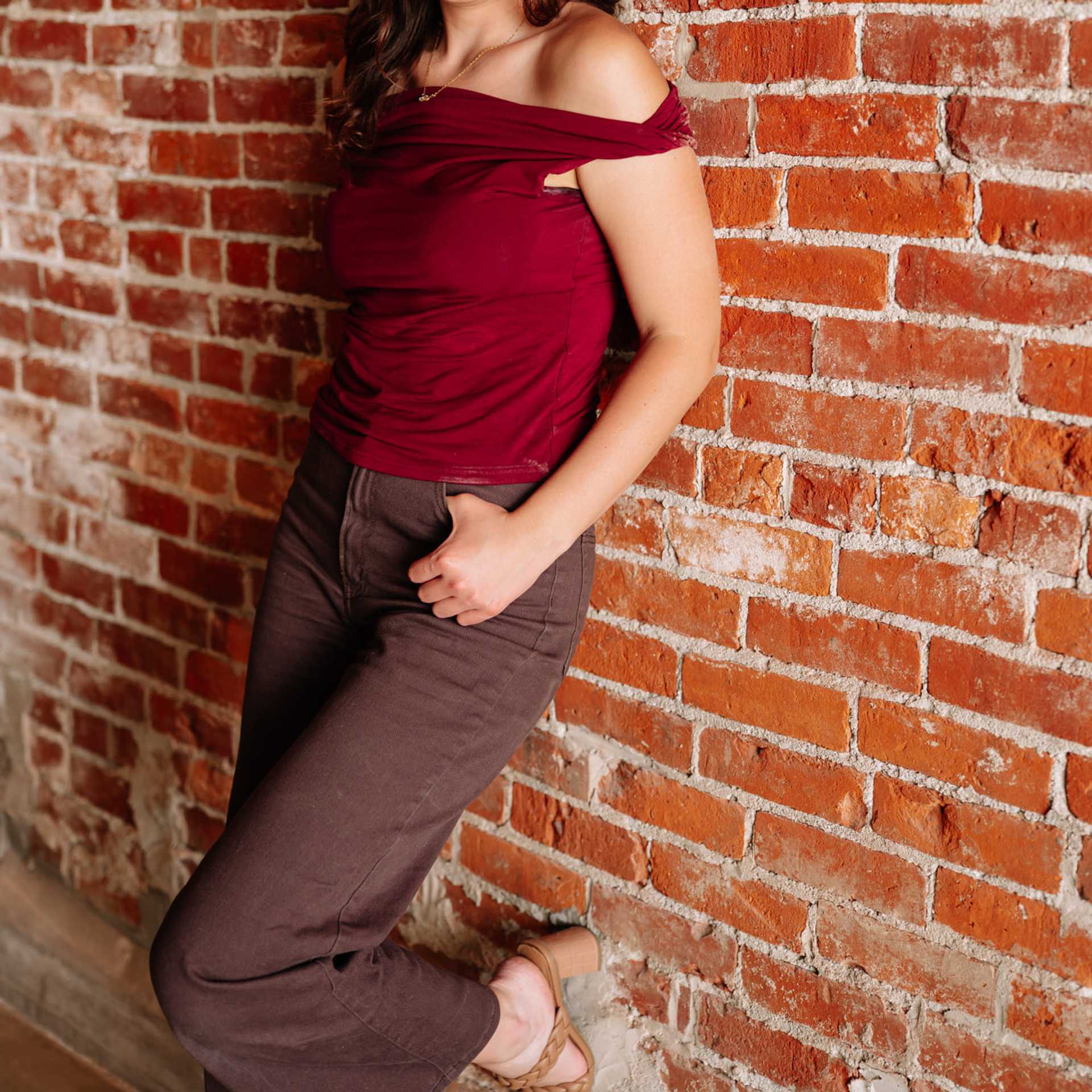 Portrait of Kaydree Frey, a professional stylist at Revive Hair Salon & Day Spa, showcasing their expertise and style.