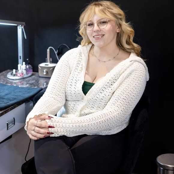 Portrait of Emma Yaple, a professional stylist at Revive Hair Salon & Day Spa, showcasing their expertise and style.