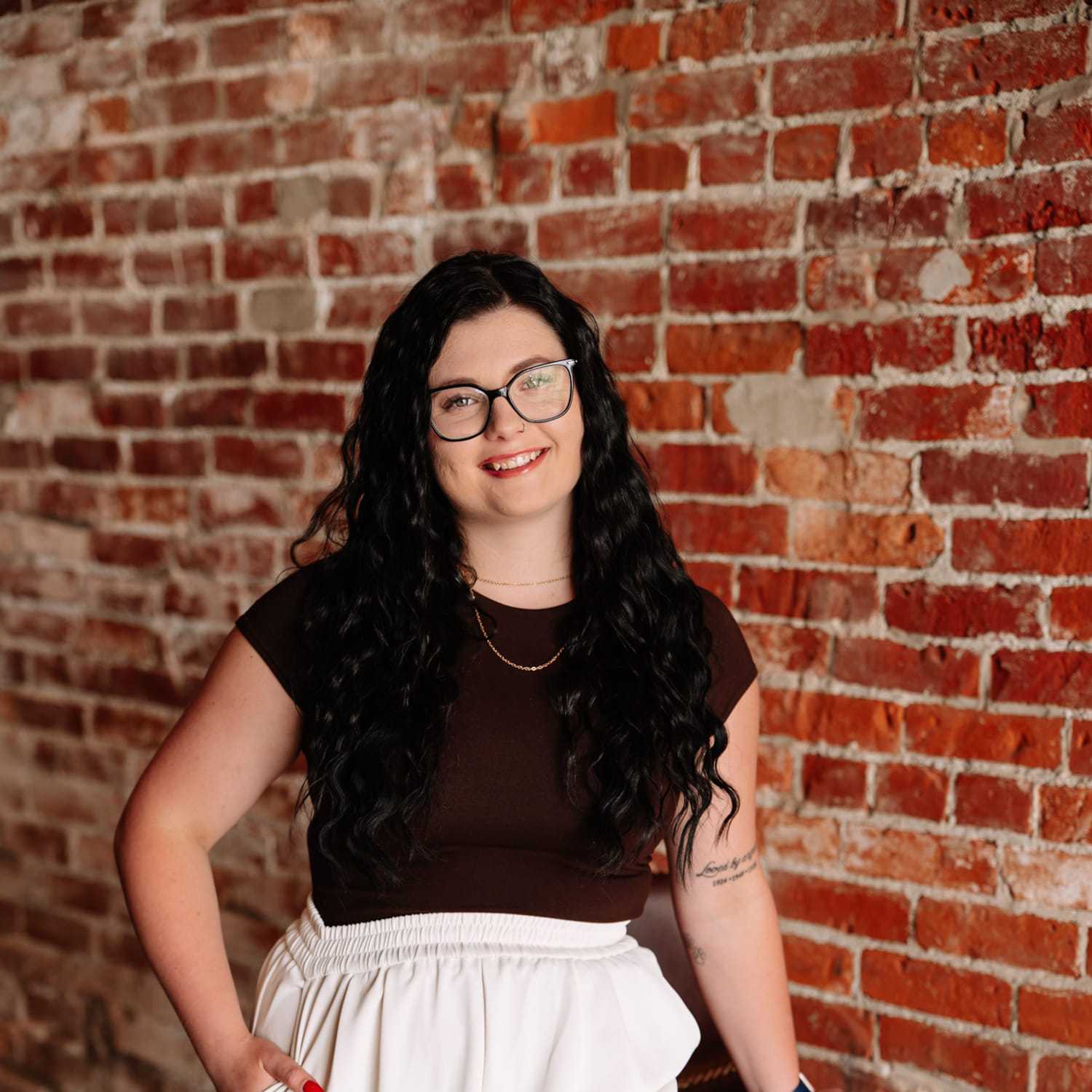 Portrait of Ashley Maag, a professional stylist at Revive Hair Salon & Day Spa, showcasing their expertise and style.