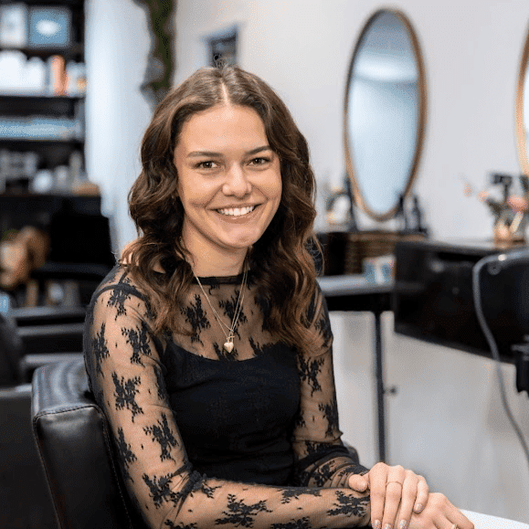 Portrait of Kaydree Frey, a professional stylist at Revive Hair Salon & Day Spa, showcasing their expertise and style.