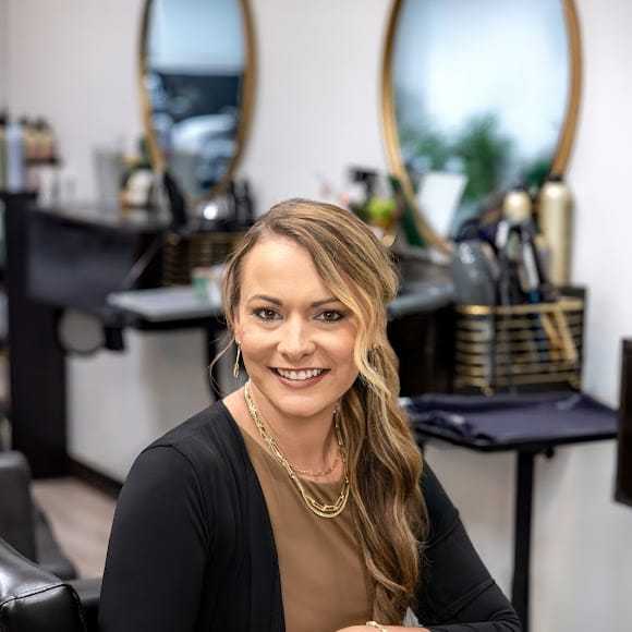 Portrait of Ashley Boehler, a professional stylist at Revive Hair Salon & Day Spa, showcasing their expertise and style.