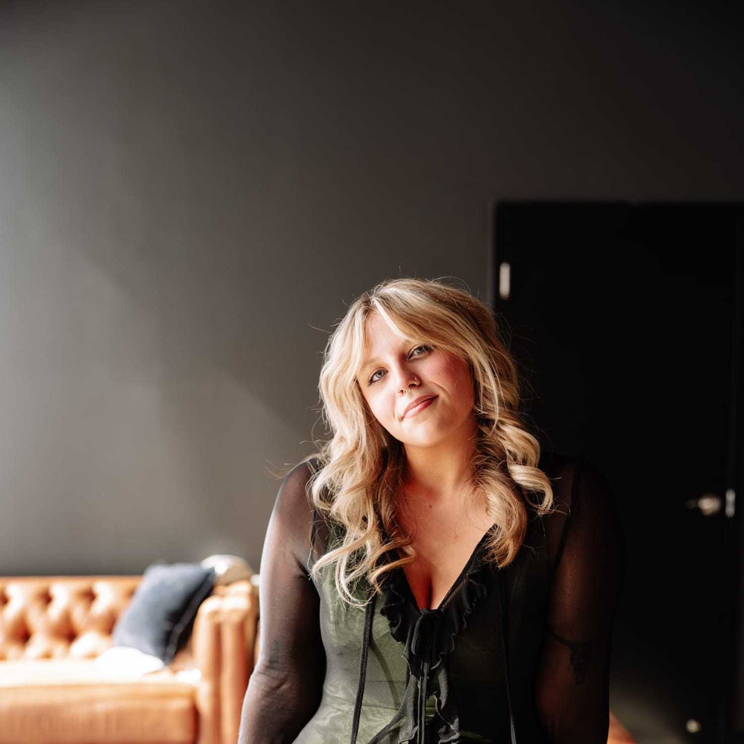 Portrait of Emma Yaple, a professional stylist at Revive Hair Salon & Day Spa, showcasing their expertise and style.