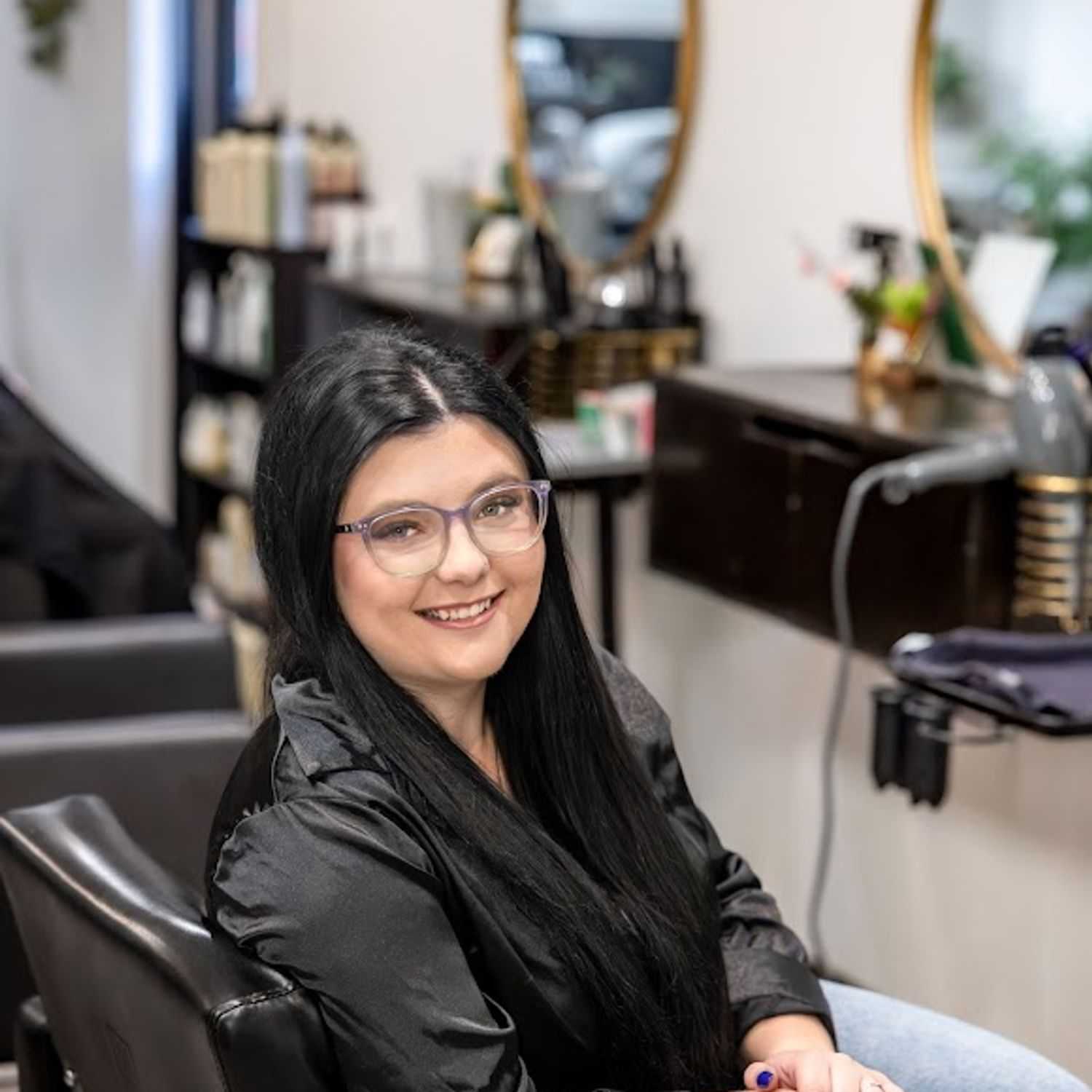 Portrait of Ashley Maag, a professional stylist at Revive Hair Salon & Day Spa, showcasing their expertise and style.