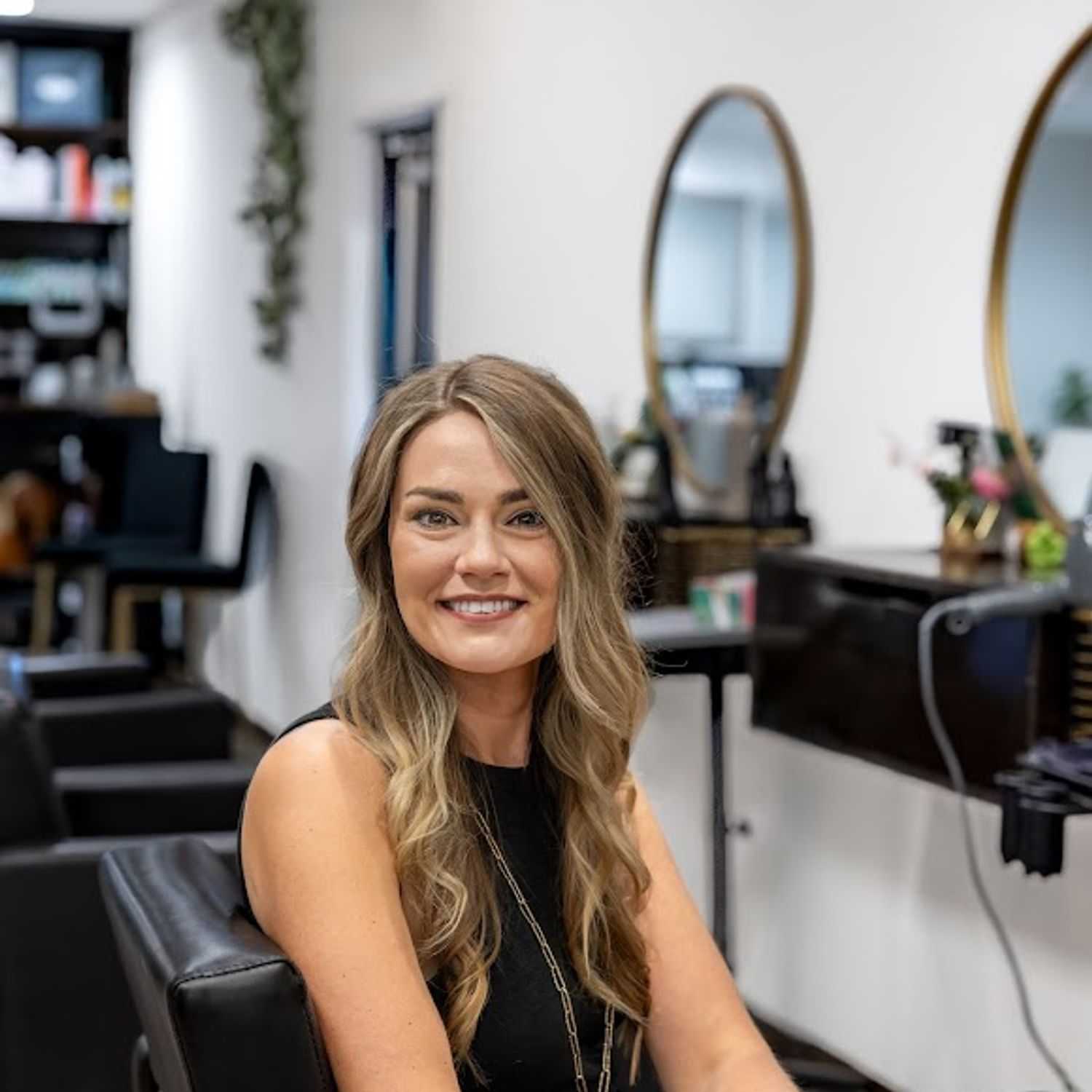 Portrait of Weslie Cheney, a professional stylist at Revive Hair Salon & Day Spa, showcasing their expertise and style.