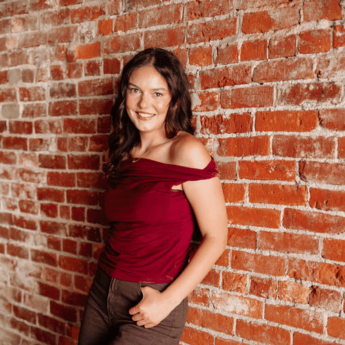 Portrait of Kaydree Frey, a professional stylist at Revive Hair Salon & Day Spa, showcasing their expertise and style.