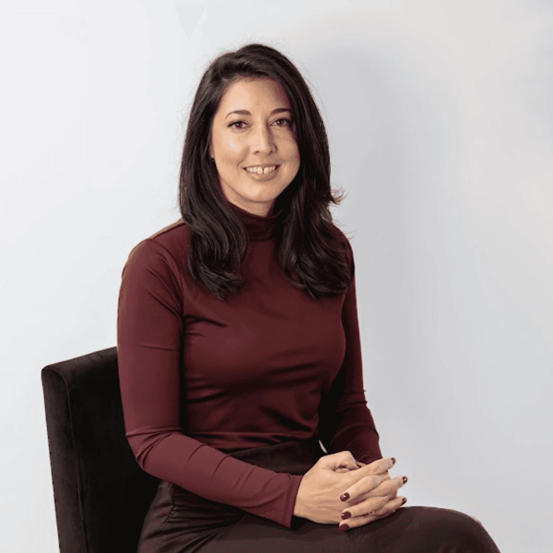 Portrait of Emily Adkins, a professional stylist at Revive Hair Salon & Day Spa, showcasing their expertise and style.